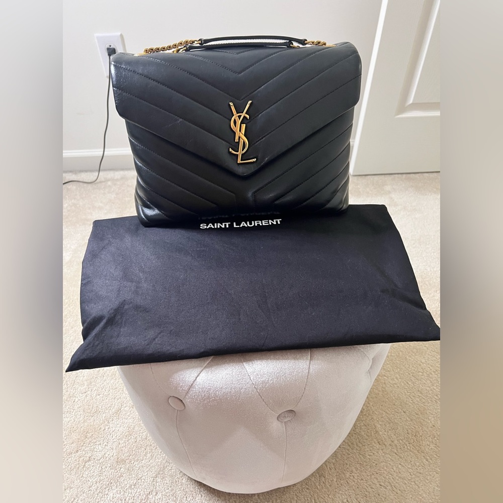 Currently in stores for $3200- Medium LouLou gently used. Dust bag included